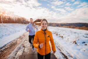 MVM Health patients enjoying pain-free outdoor running together in winter snow