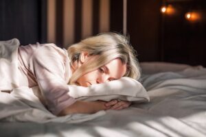 Woman experiencing chronic pain and emotional distress while resting