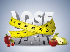 Weight loss concept with measuring tape and healthy foods representing medically supervised weight loss programs