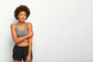 Woman is suffering from Throbbing Arm pain
