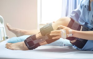woman is sitting in MVM Clinic after getting the Surgery of Knee