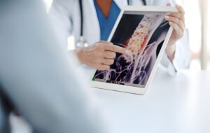 doctor is explaining about Spinal Pain at MVM Clinic