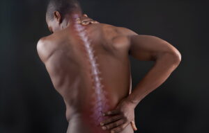 Man is suffering from Thoracic Spinal Pain