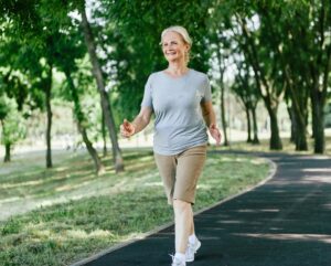 old woman is smiling and running after successful got the treatment at MVM Health clinic