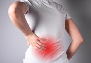 Woman suffering from lower back pain