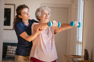 doctor is helping Patient in workout for shoulder pain