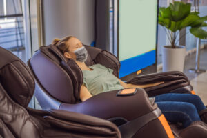 woman is sitting on Massage Chair getting massage at MVM Clinic