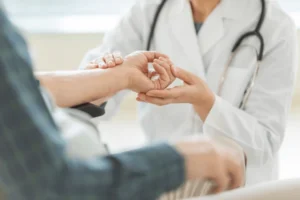 Doctor sitting at desk and check her patient