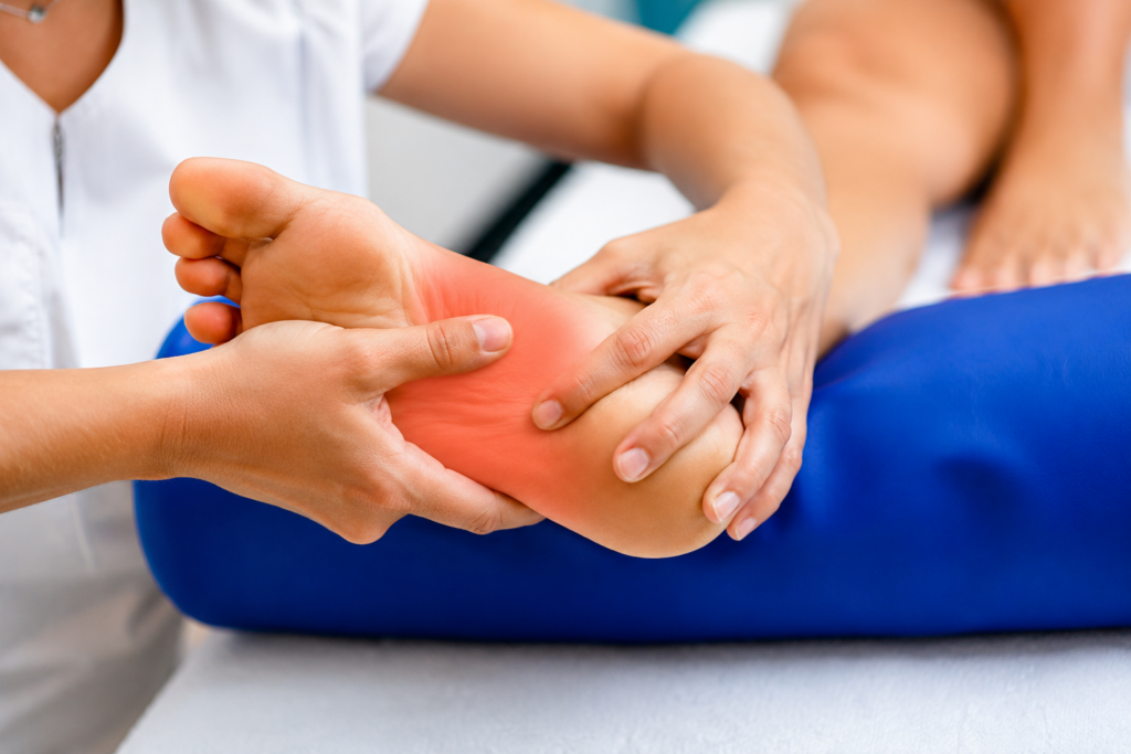 Healthcare professional examining foot pain for Neuropathic Pain Treatment in Wayne