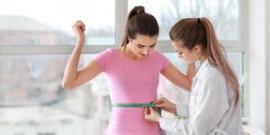 Patient undergoing Peptide Therapy for Weight Loss with body measurement assessment