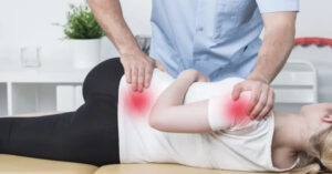 Chiropractor performing manual therapy for shoulder and lower back pain relief