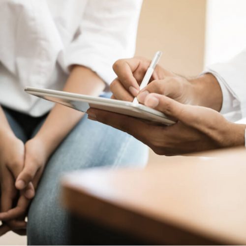 psychiatrist consulting female illness
